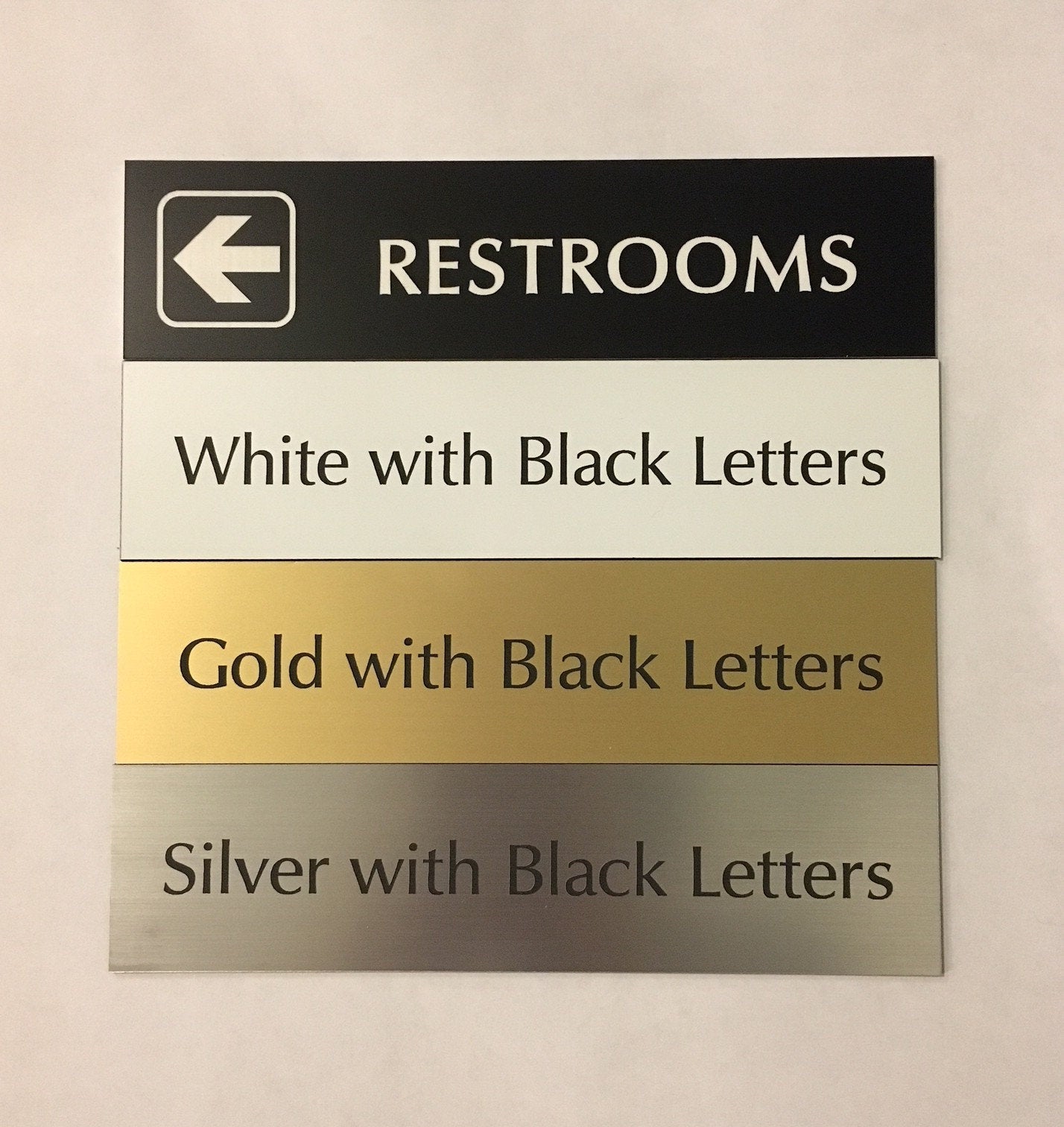 2" x 8" (RESTROOMS Left Arrow) Laser Engraved Sign